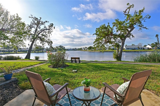 view of patio with a water view