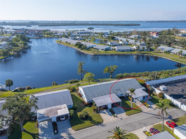 bird's eye view featuring a residential view and a water view