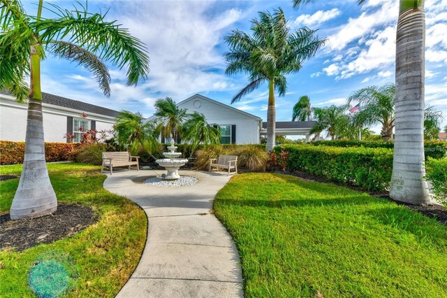 view of community featuring a lawn