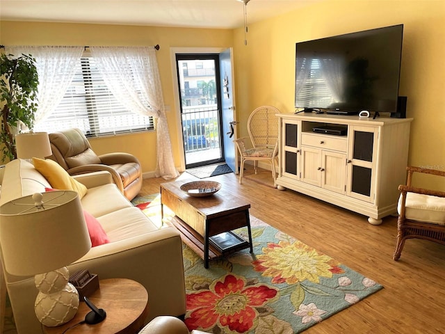 living room with light hardwood / wood-style flooring