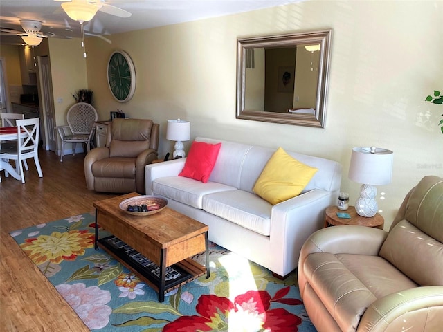 living room with hardwood / wood-style floors and ceiling fan