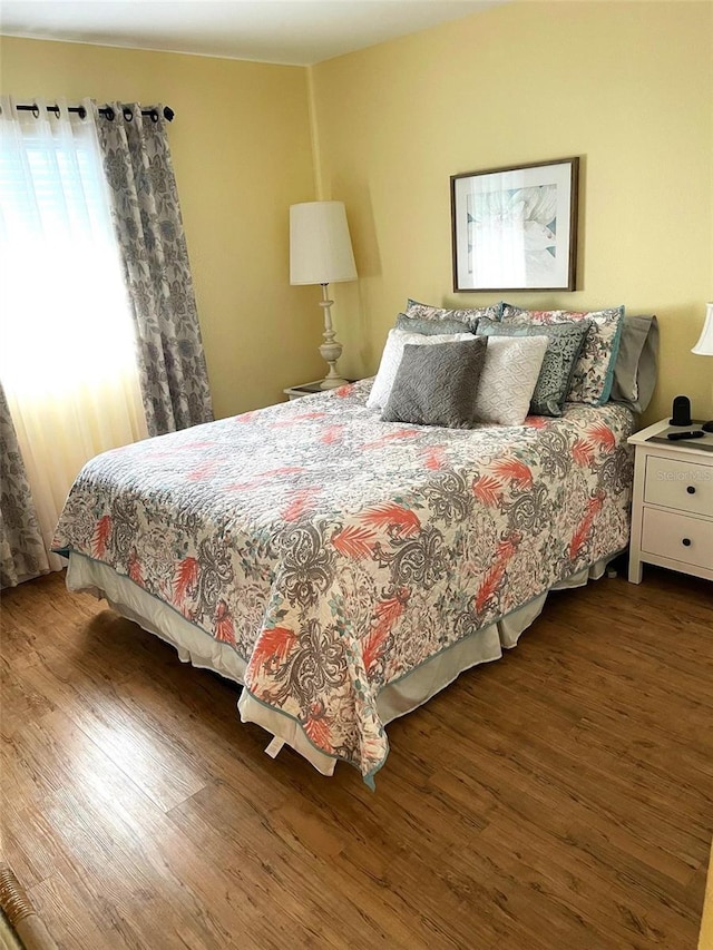 bedroom featuring dark hardwood / wood-style floors