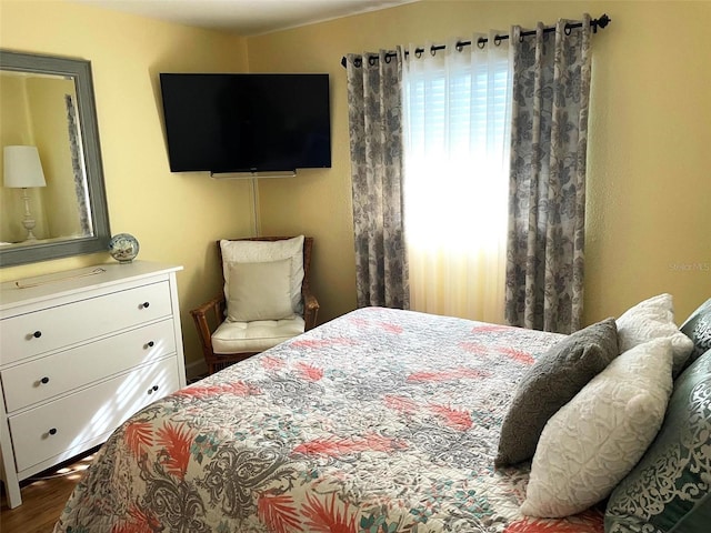 bedroom featuring hardwood / wood-style floors