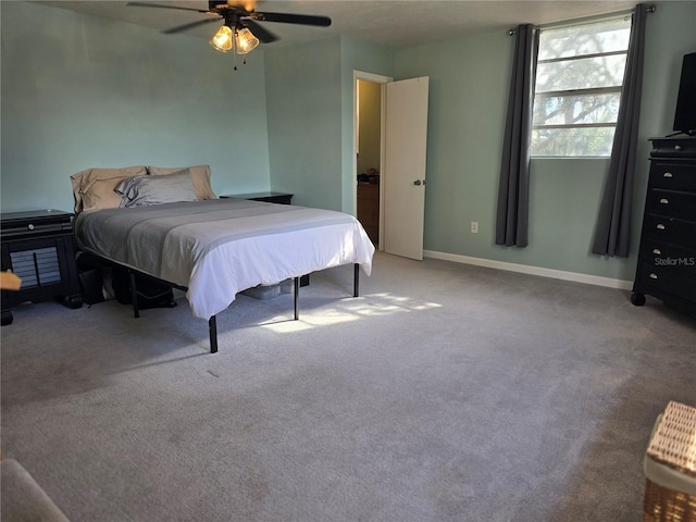 bedroom with ceiling fan and light colored carpet