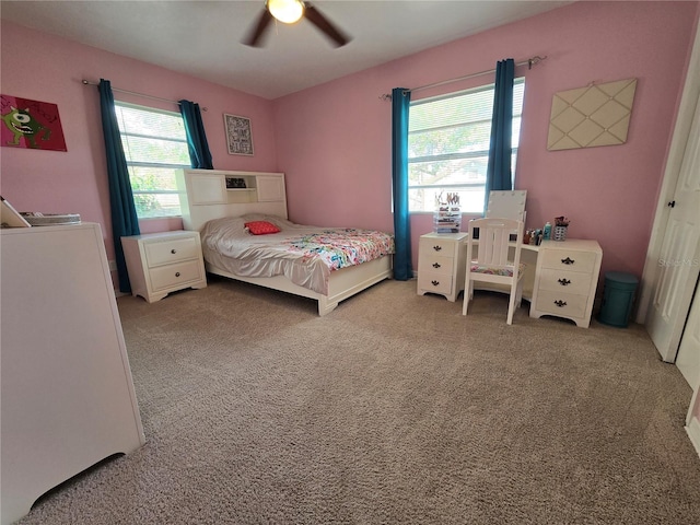 bedroom featuring carpet, ceiling fan, and a closet