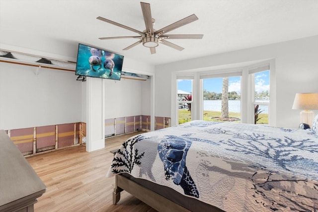 bedroom featuring ceiling fan and light hardwood / wood-style flooring