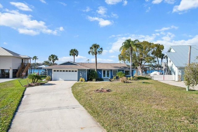 view of front of house featuring a front yard and a garage