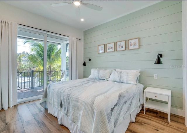 bedroom featuring ceiling fan, access to exterior, and light wood-type flooring