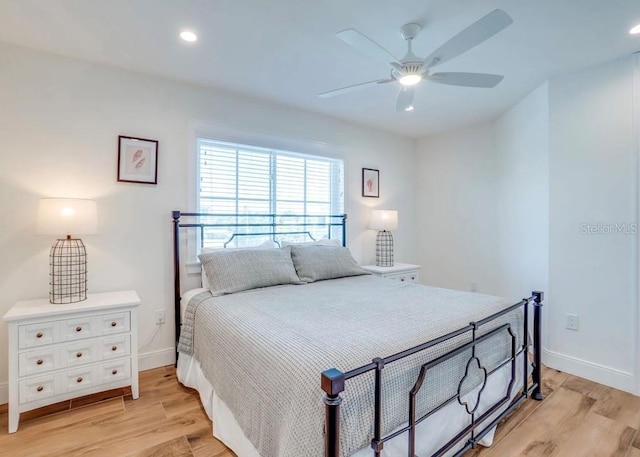 bedroom featuring light hardwood / wood-style flooring and ceiling fan