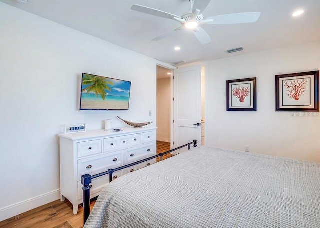 bedroom featuring ceiling fan and light hardwood / wood-style floors