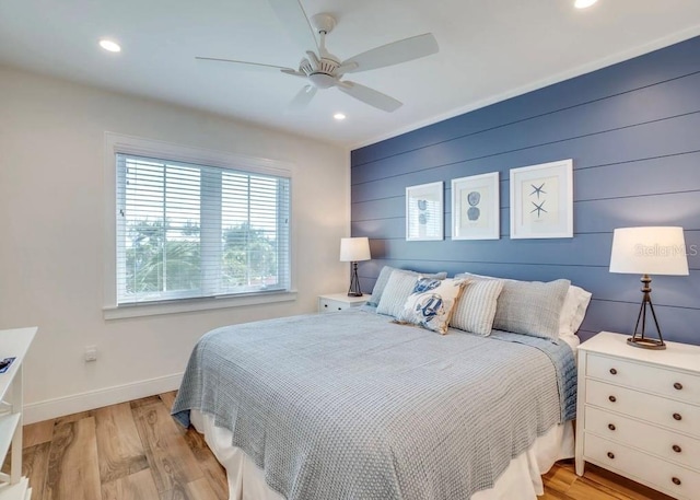 bedroom featuring light hardwood / wood-style flooring and ceiling fan