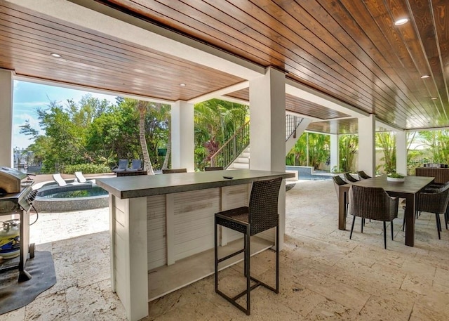 view of patio with an outdoor bar