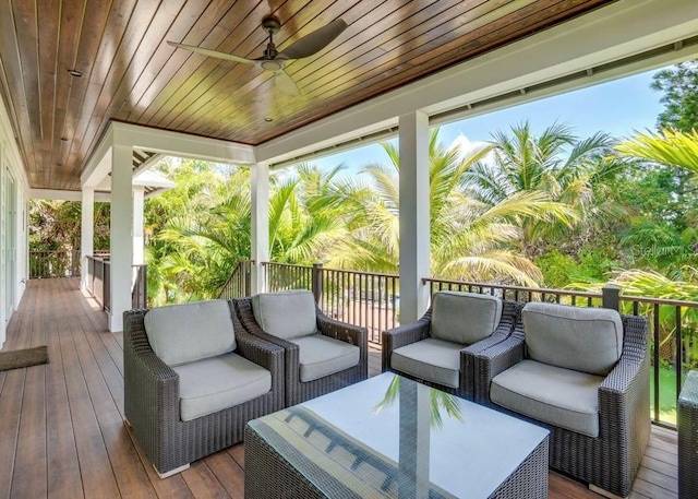 deck featuring an outdoor living space and ceiling fan