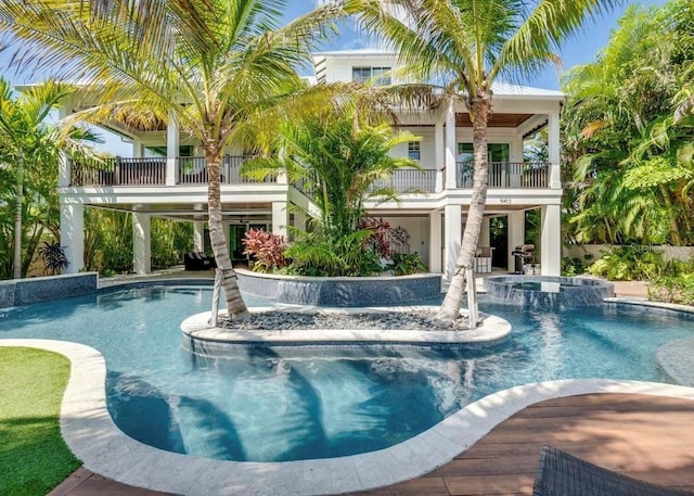 view of pool featuring an in ground hot tub