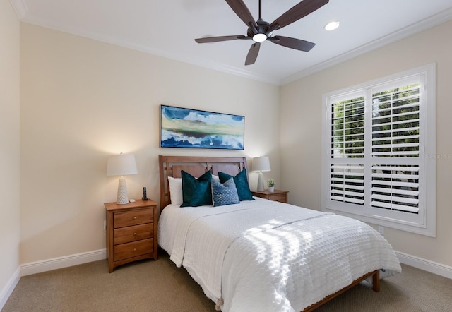 carpeted bedroom featuring ceiling fan and crown molding