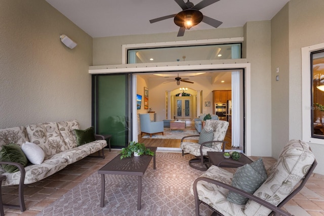 view of patio / terrace with ceiling fan and french doors