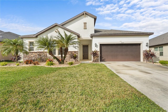 view of front facade with a front yard and a garage