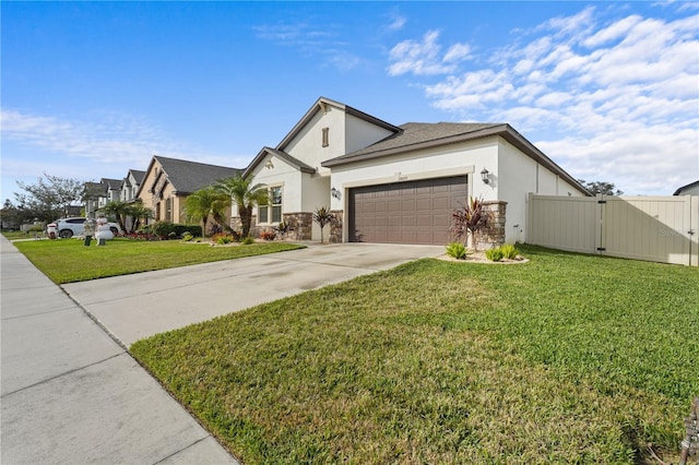 view of front facade with a garage and a front lawn