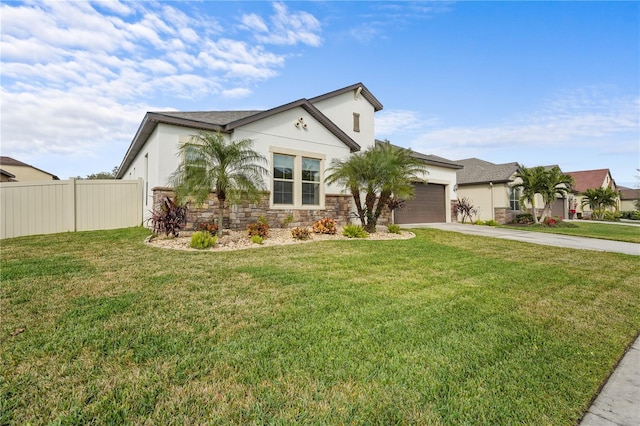 view of front of home featuring a front yard and a garage