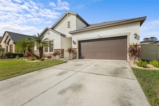 view of front of property featuring a front lawn and a garage