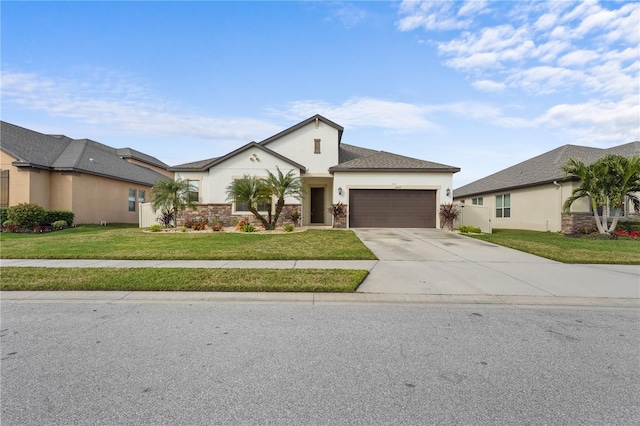 view of front of home with a garage and a front lawn