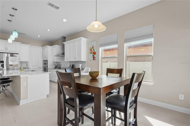 dining room featuring sink