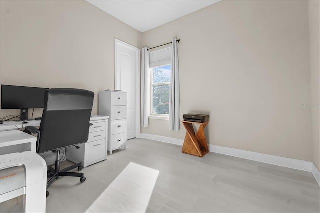 office area with light hardwood / wood-style floors