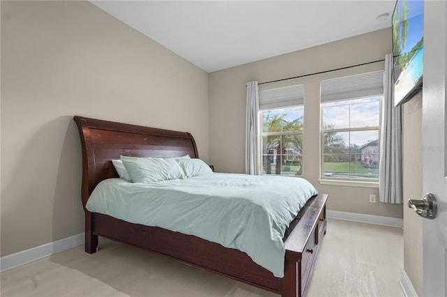 bedroom with lofted ceiling