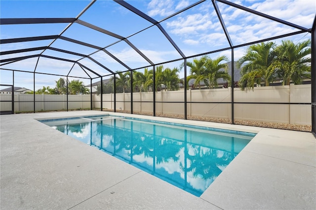 view of pool with a patio and a lanai