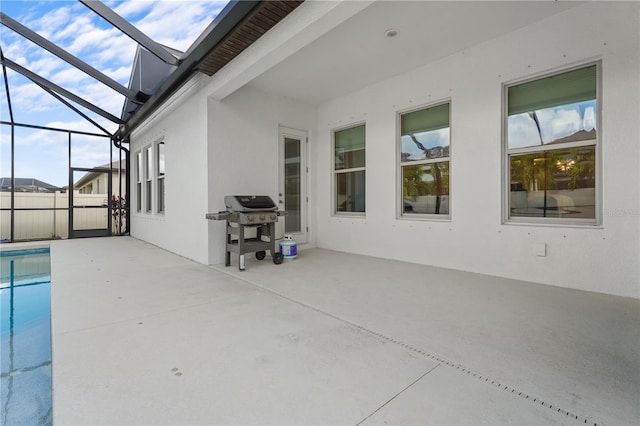 view of patio / terrace featuring a lanai and a grill