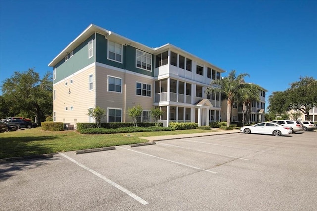 view of building exterior with central AC unit