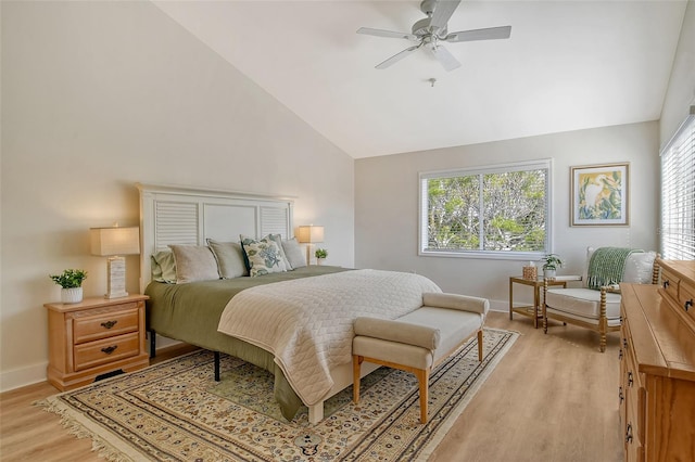 bedroom with ceiling fan, high vaulted ceiling, and light wood-type flooring