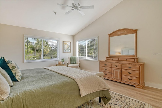 bedroom with vaulted ceiling, ceiling fan, and light hardwood / wood-style flooring