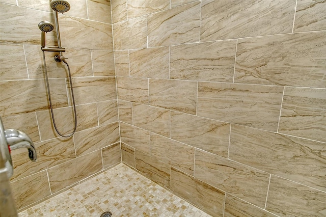 bathroom with a tile shower