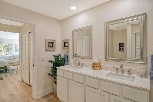 bathroom featuring hardwood / wood-style flooring and vanity