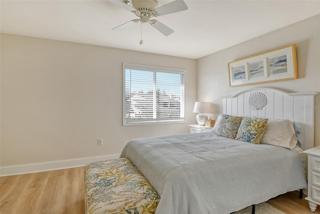 bedroom with ceiling fan and hardwood / wood-style floors