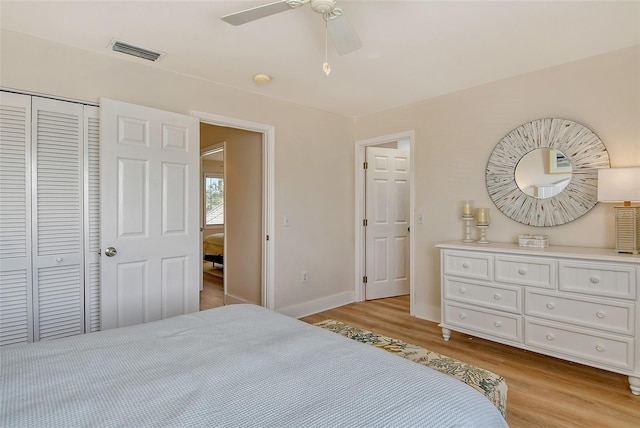 bedroom with ceiling fan, a closet, and light hardwood / wood-style flooring