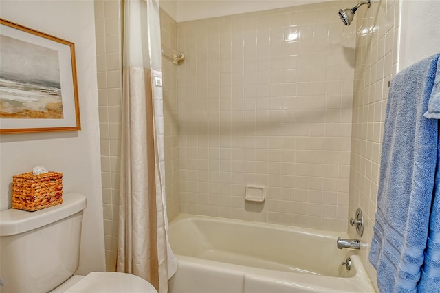 bathroom with toilet and shower / bath combo with shower curtain