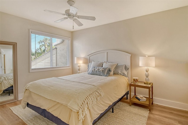 bedroom featuring ceiling fan and light hardwood / wood-style floors