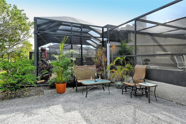 view of patio / terrace with a lanai