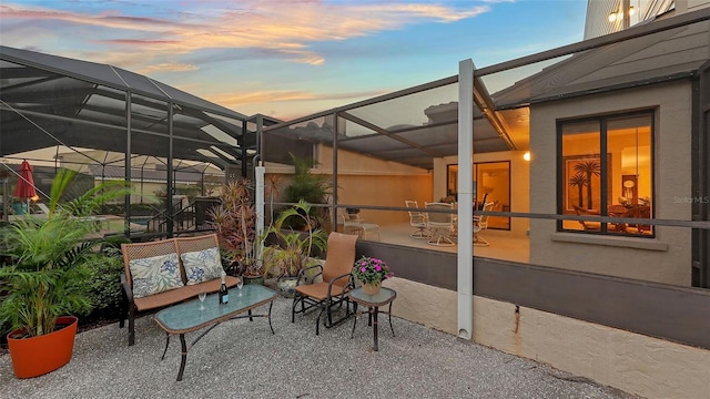 patio terrace at dusk with glass enclosure