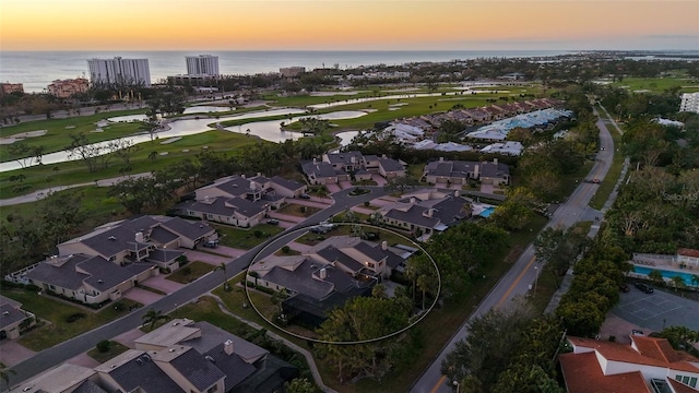 aerial view at dusk with a water view