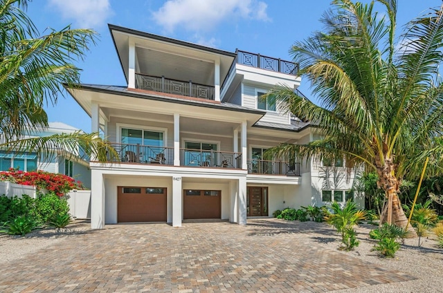 view of front of property with a balcony and a garage