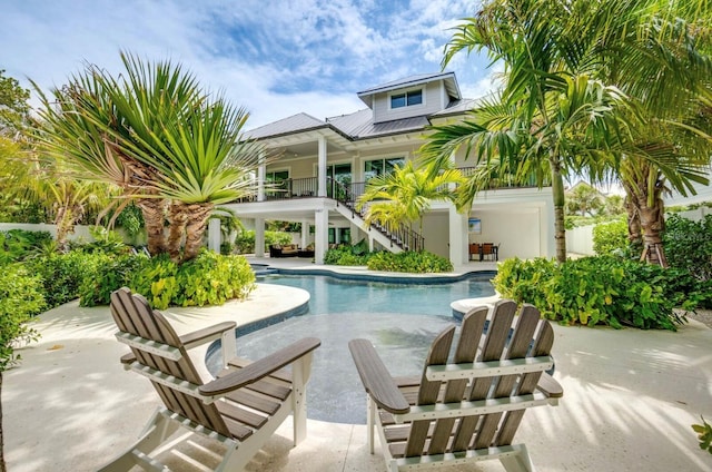 view of swimming pool featuring a patio area