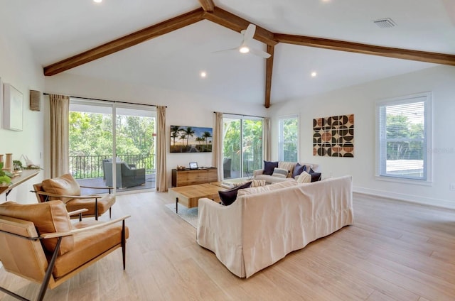 living room with ceiling fan, high vaulted ceiling, beamed ceiling, and light wood-type flooring