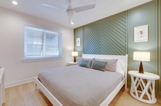 bedroom with ceiling fan and light wood-type flooring