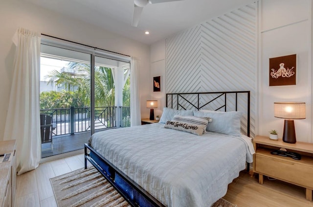 bedroom featuring access to outside and light hardwood / wood-style flooring