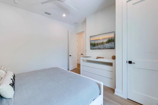 bedroom with ceiling fan and light hardwood / wood-style flooring