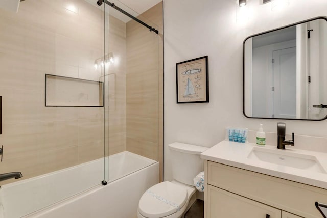 full bathroom with vanity, shower / bath combination with glass door, and toilet