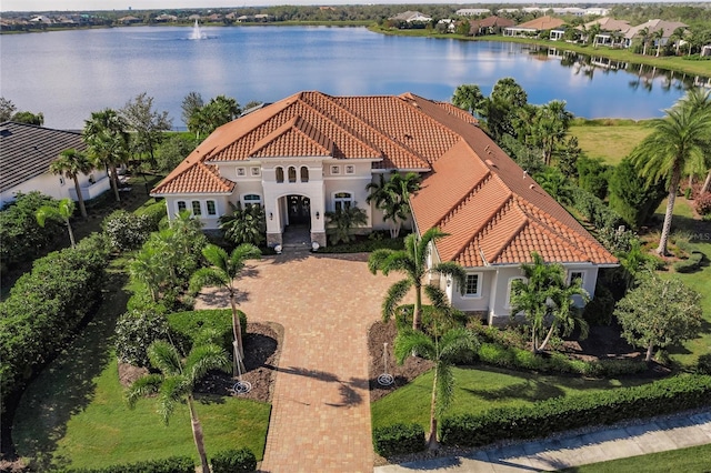 mediterranean / spanish house with a water view